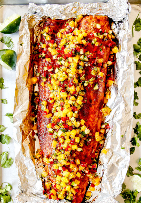 top view of bakes salmon in foil with mango salsa