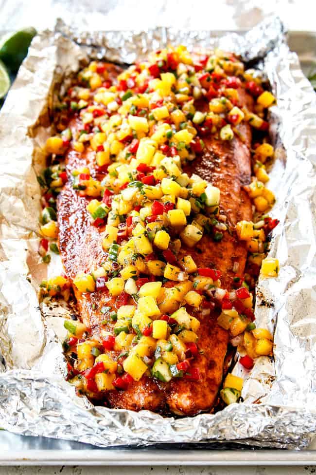 front view of bake salmon in foil with mango salsa