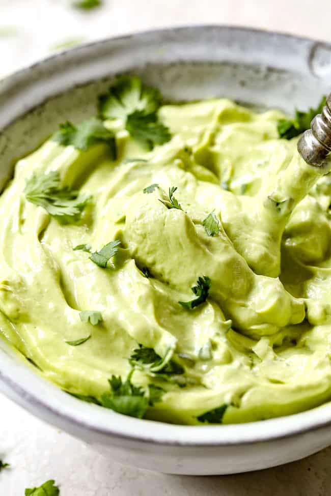 a bowl of creamy avocado crema 