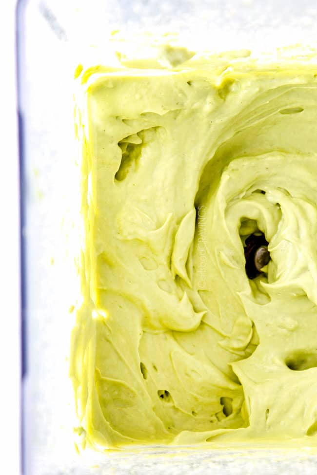 showing how to make avocado crema by blending until smooth in blender