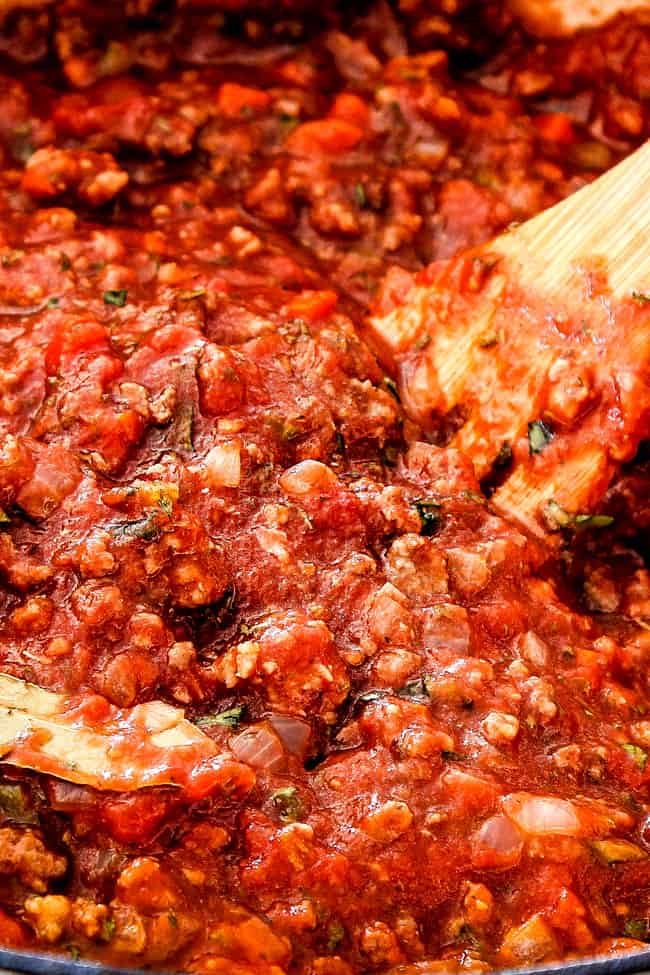 showing how to make the traditional bolognese sauce by simmering reduced 