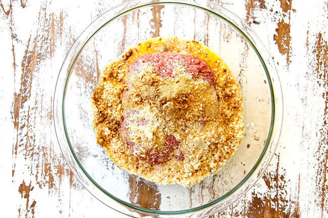 showing how to make cranberry meatballs by combining lean ground beef, eggs, seasonings and milk in a glass bowl