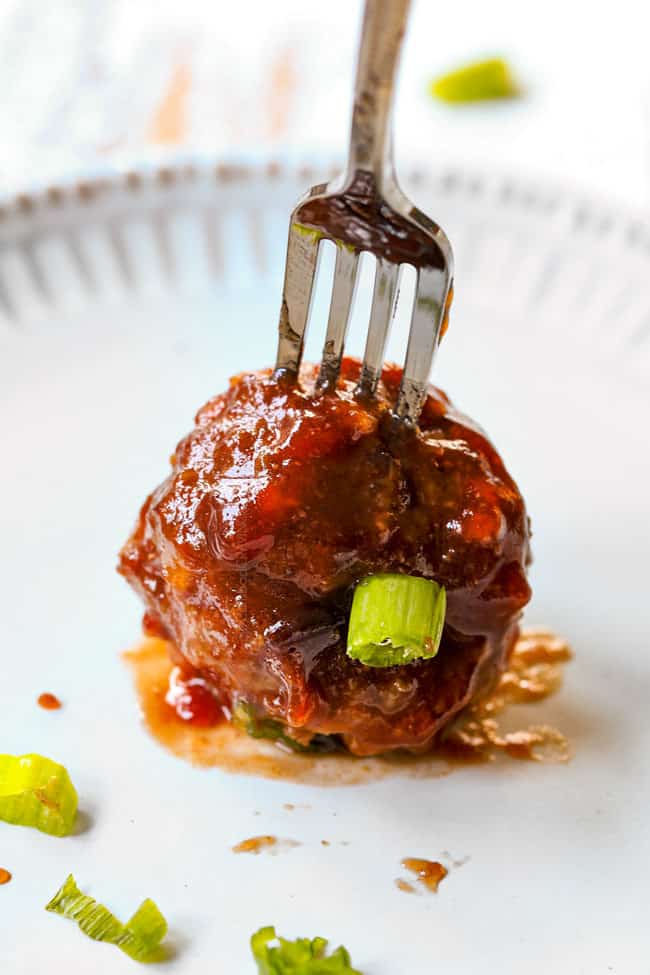 up close of appetizer cranberry meatball on a fork