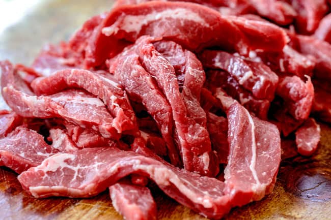 showing how to make Szechuan Beef by slicing steak thinly