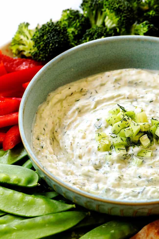 up close of Tzatziki in a bowl with vegetables to dip