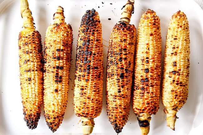showing how to make elote by grilling corn
