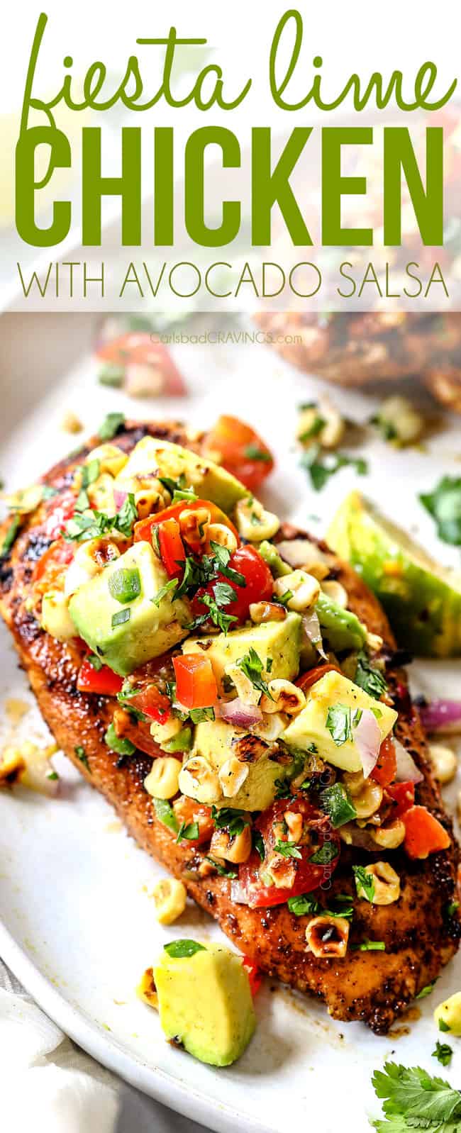 fiesta lime chicken on a white plate with avocado salsa