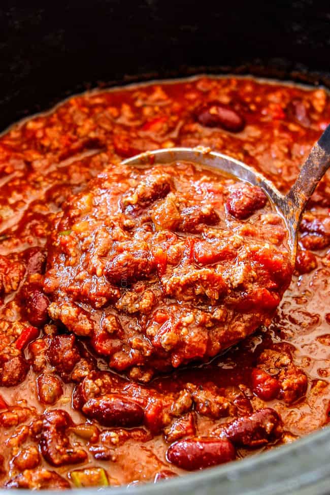 a spoon serving easy crockpot chili from the slow cooker