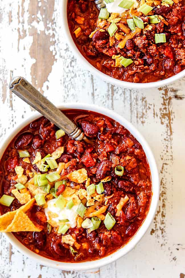 top view of two bowls of meaty crockpot chili recipe
