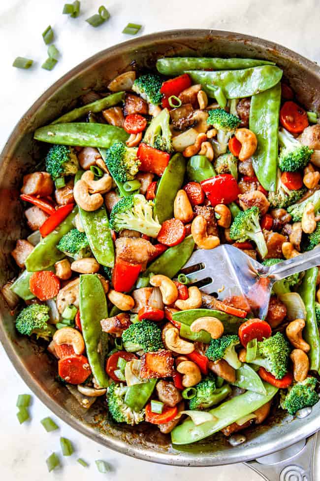 top view of easy chicken stir fry recipe with chicken, broccoli, carrots, bell peppers, snap peas