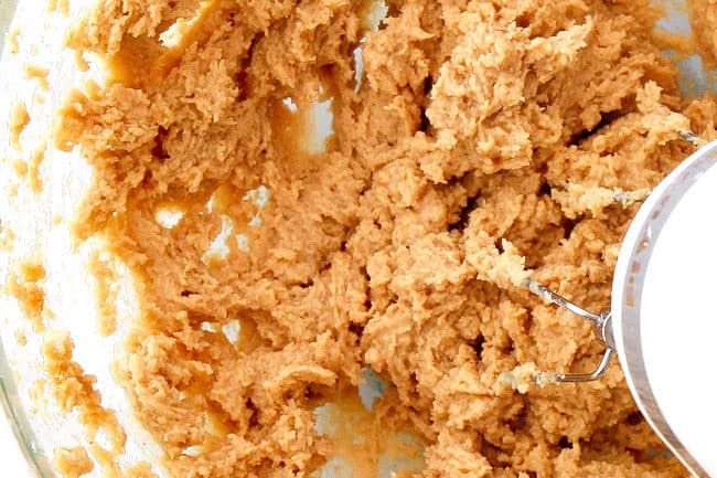 showing how to make peanut butter balls by mixing peanut butter mixture until creamy