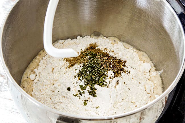 showing how to make leftover turkey recipe by adding flour, sage, yeast to a mixing bowl