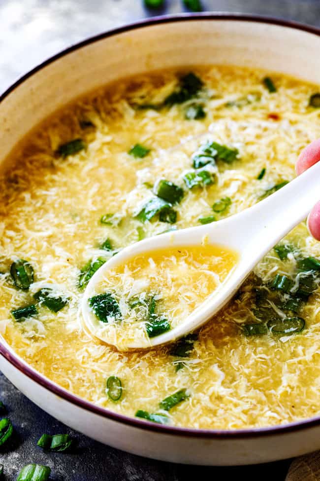 a spoon scooping up easy egg drop soup