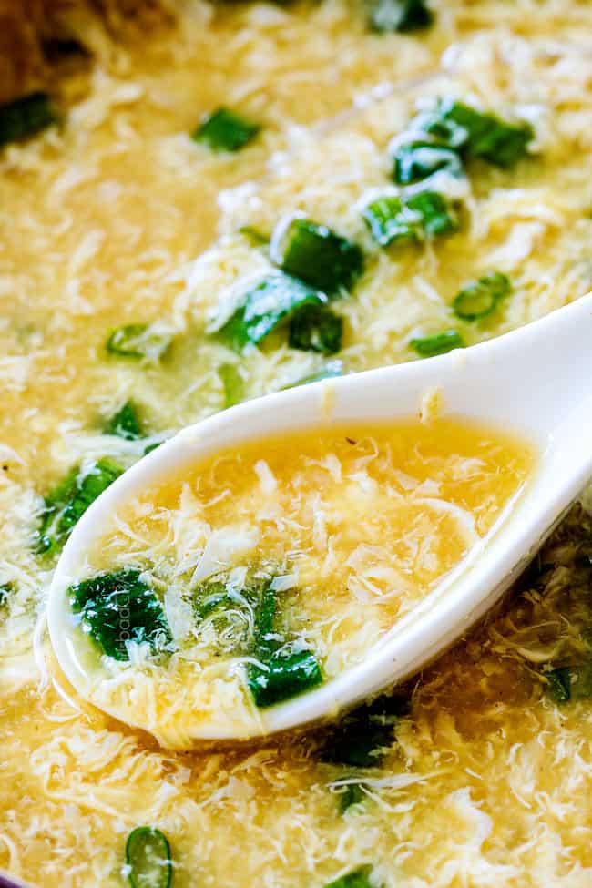 up close of homemade Egg Drop Soup in a spoon