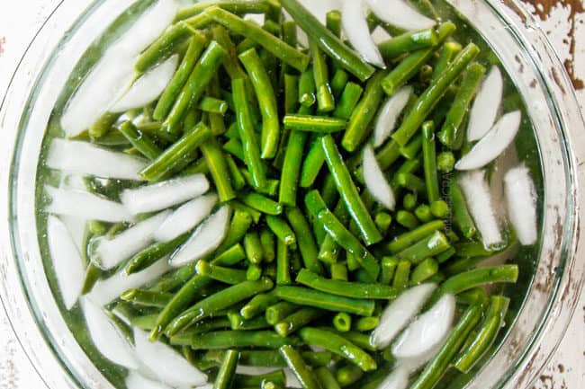 showing how to make easy green bean casserole by blanching green beans in ice water