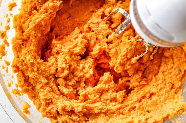 showing how to make mashed sweet potatoes by beating potatoes until creamy