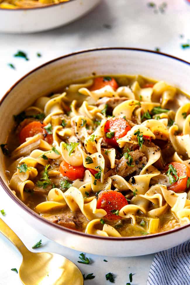 a bowl of easy chicken noodle soup made with rotisserie chicken or thicken thighs