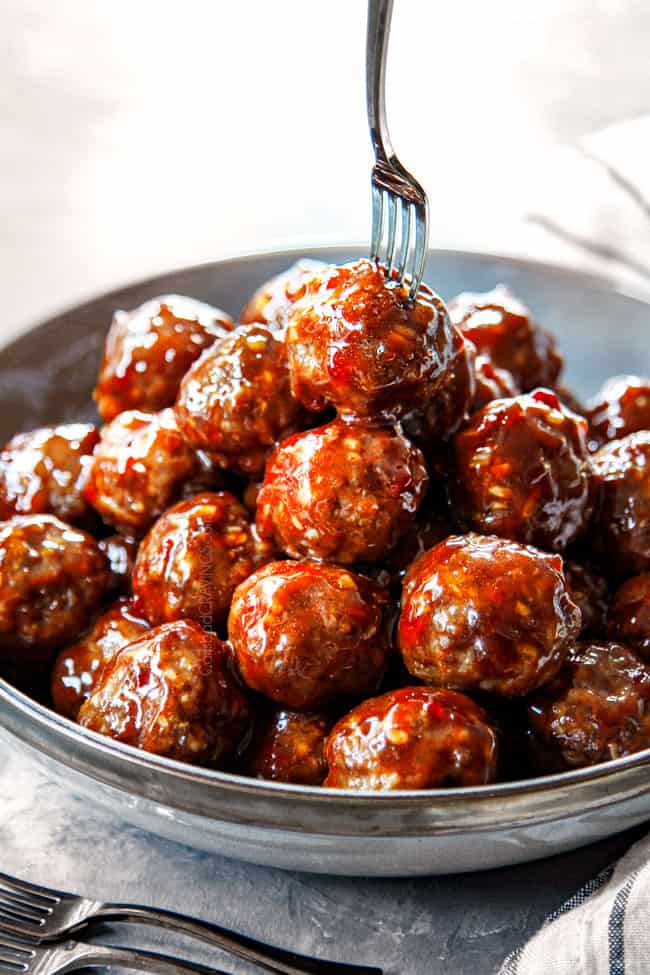 up close of serving cocktail meatballs in a bowl 