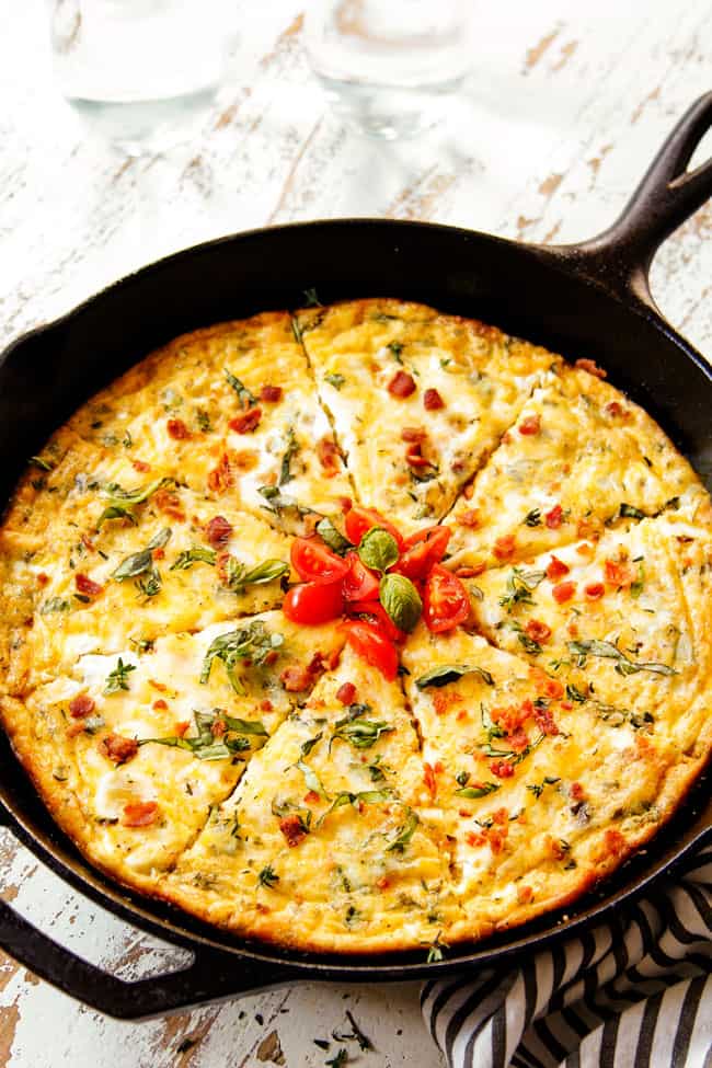 showing how to make a frittata by removing cast iron pan from the oven