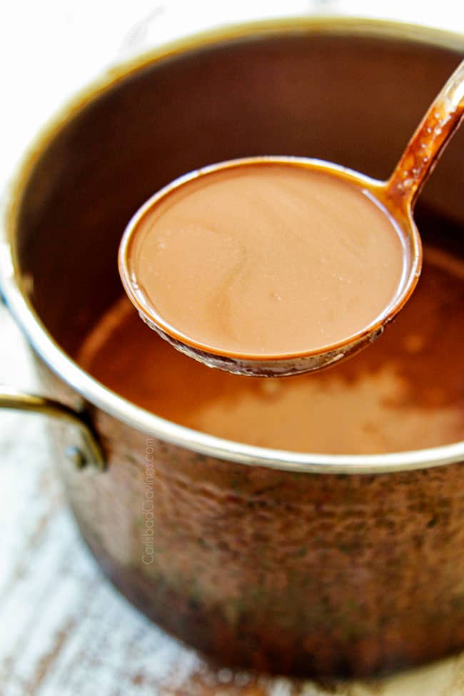showing how to make hot chocolate by scooping into a ladle to serve