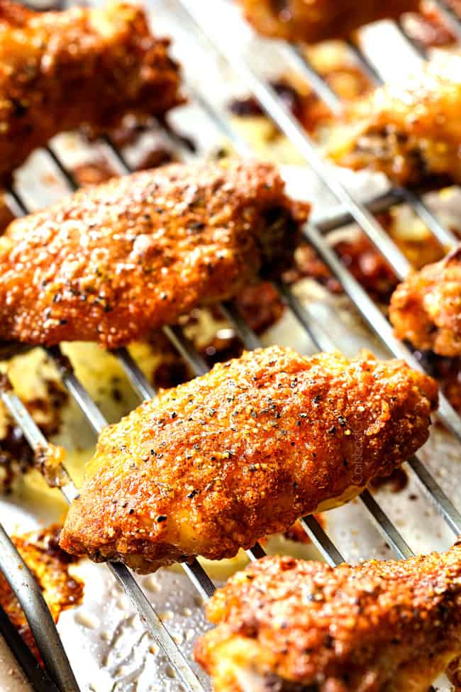 showing how to make baked lemon pepper wings by broiling until crispy