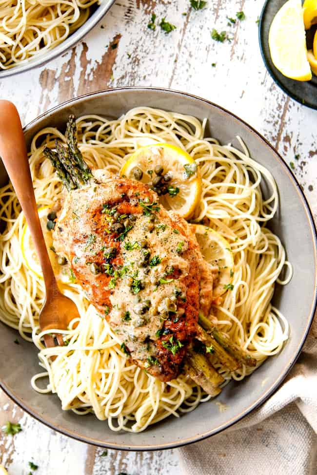 top view showing how to serve chicken piccata by adding to a bowl of pasta
