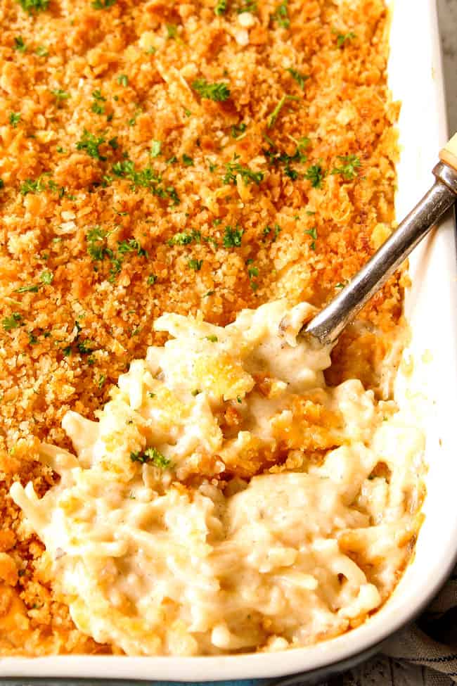 scooping how creamy and cheesy  hashbrown casserole 