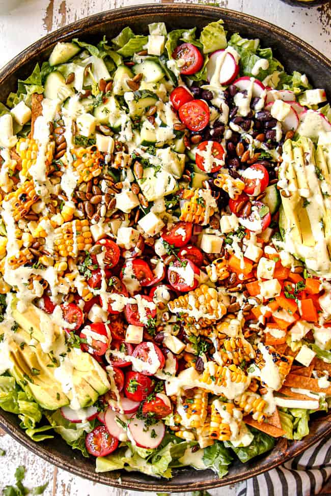 top view of assembled Mexican salad recipe drizzled with dressing