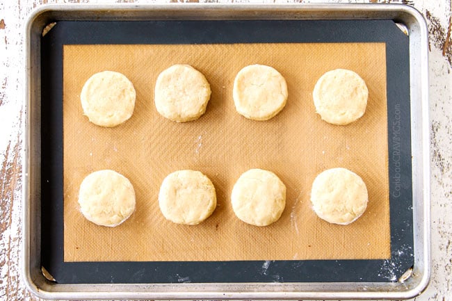 showing how to make Strawberry Shortcake by placing 8 biscuit dough rounds on a nonstick mat