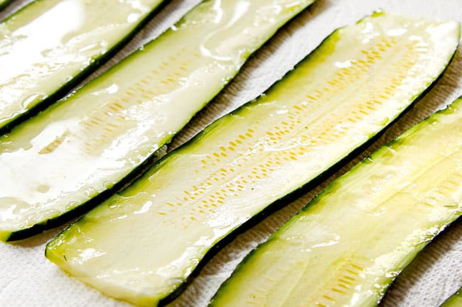 showing how to make zucchini lasagna less watery by salting zucchini slices