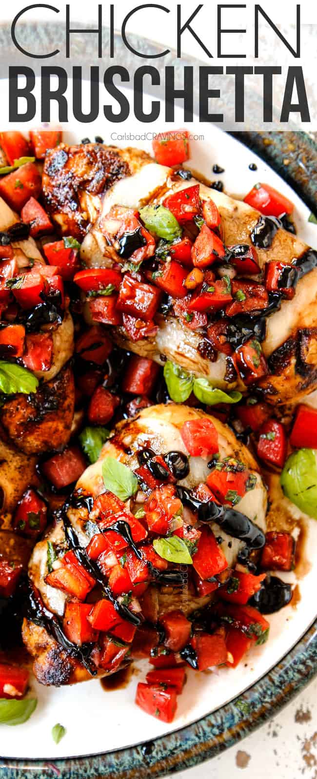 top view of bruschetta chicken on a white platter drizzled with balsamic reduction 