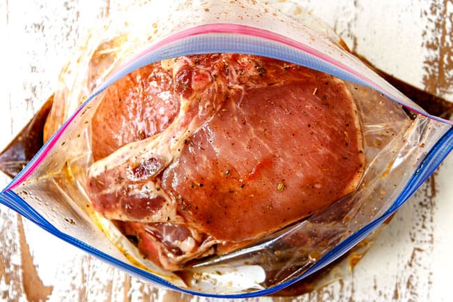 showing how to make pork chop marinade recipe by adding pork chops to a freezer size bag with marinade