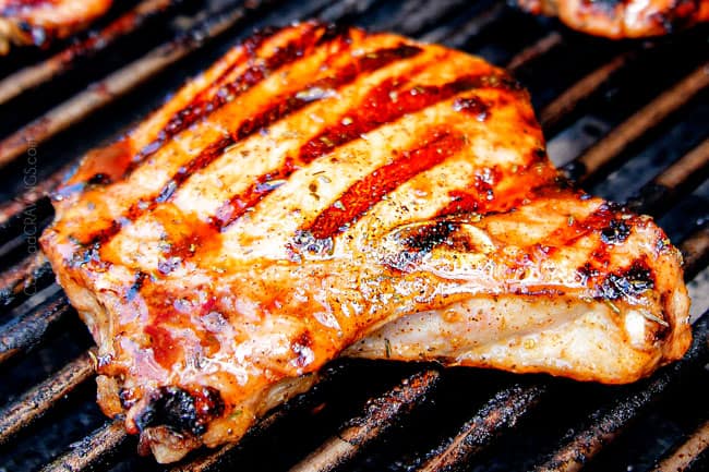 showing how to make pork chop marinade recipe by cooking pork chops on a grill