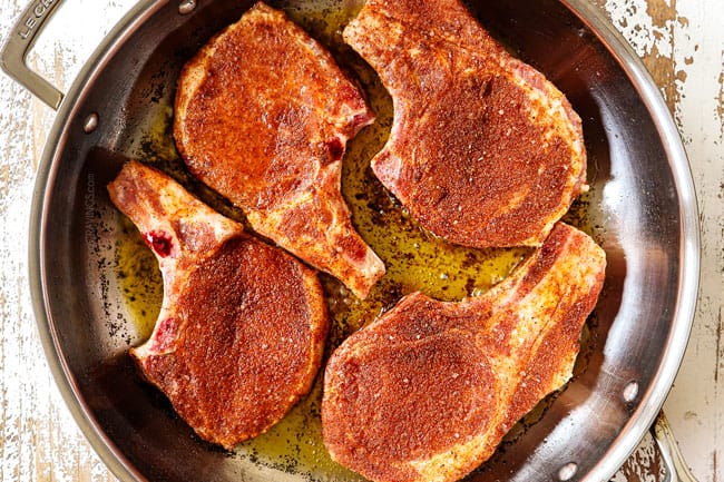 showing how to cook pork chops by searing pork chops in a skillet