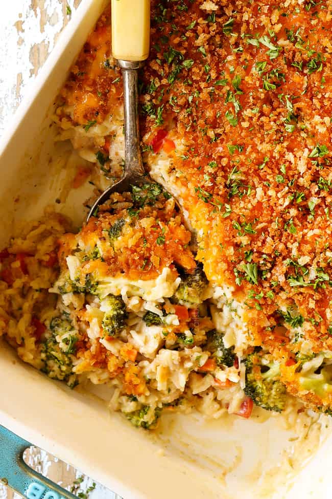 top view of chicken broccoli and rice casserole with a spoon in the dish