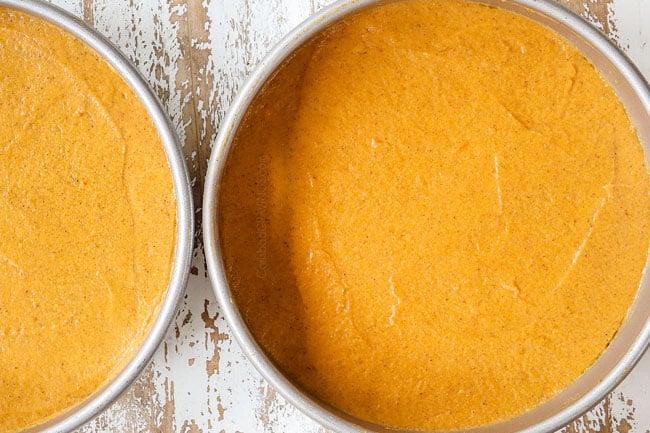showing how to make pumpkin spice cake recipe by dividing batter in between 2 pans