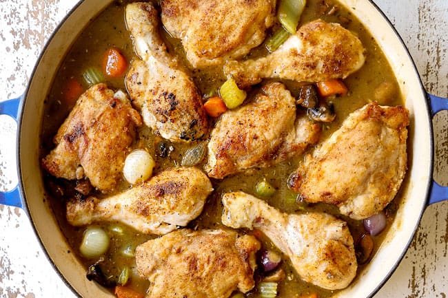 showing how to make chicken fricassee recipe by adding chicken to sauce before baking