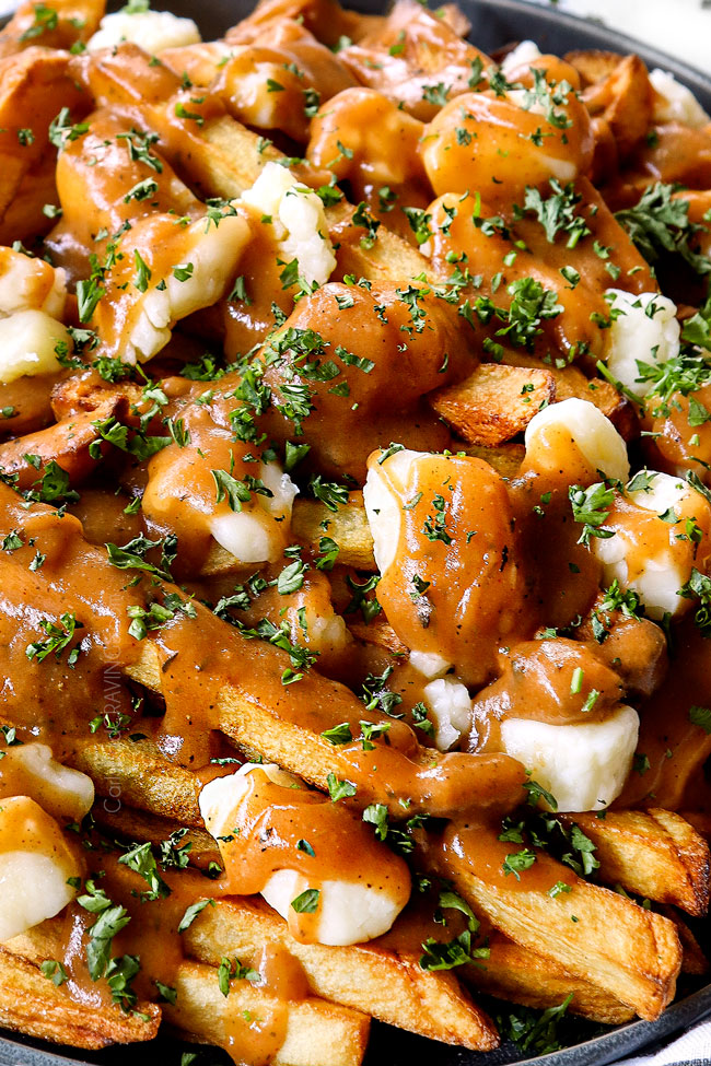 up close of Canadian poutine with gravy and cheese curds
