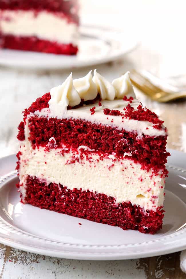 a slice of  red velvet cheesecake recipe on a white plate