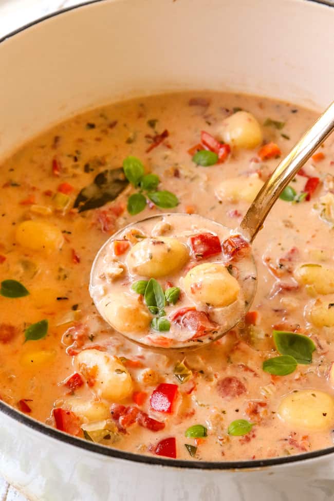 up close of a spoonful of  gnocchi soup recipe showing how creamy it is