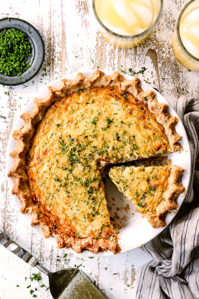 top view of ham and cheese quiche recipe with a slice cut out 