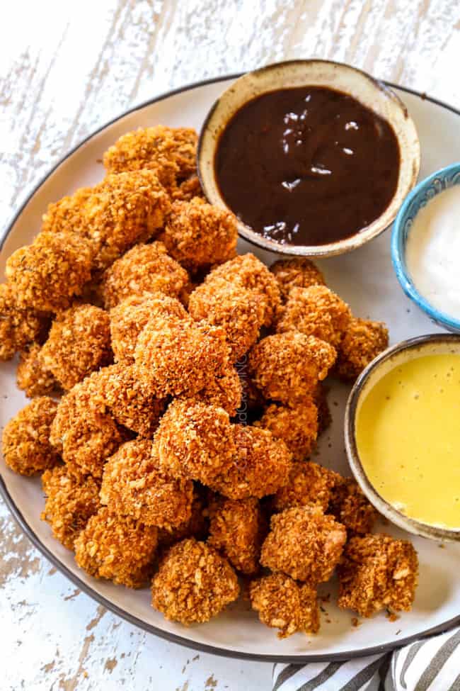 chicken nuggets recipe stacked on a white plate