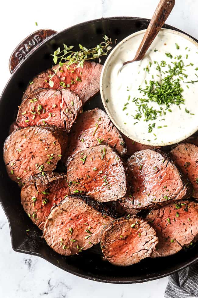 top view of beef tenderloin recipe  sliced in a cast iron skillet