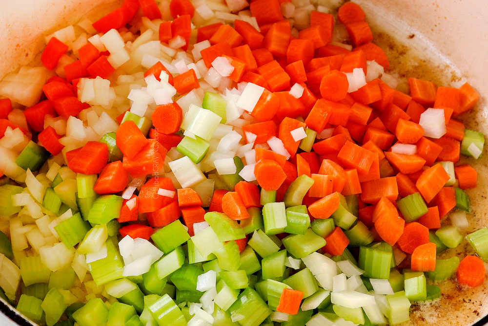 showing how to make chicken pot pie soup by sautéing vegetables