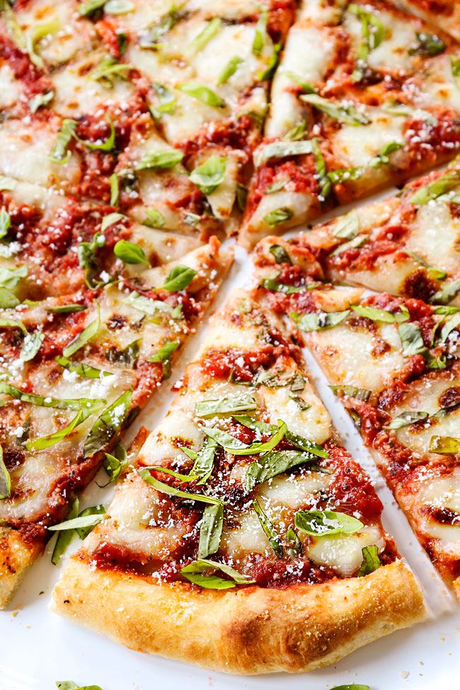 up close of a slice of homemade margherita pizza with toppings