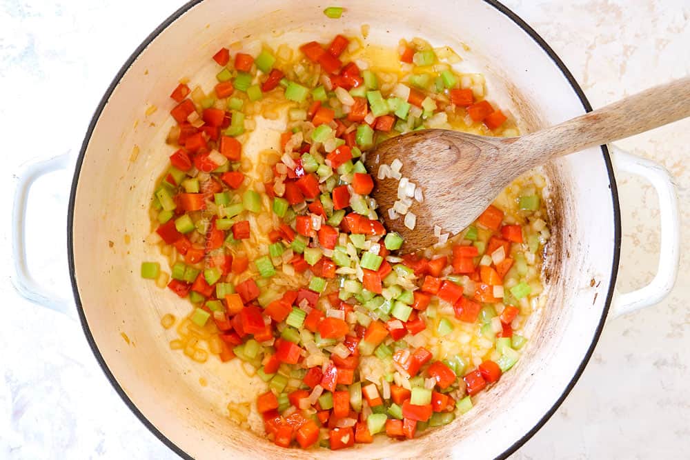 showing how to make buffalo chicken chili by sauteing onions, celery and bell peppers