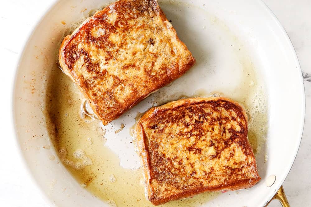 showing how to make stuffed French toast recipe by pan frying cream cheese stuffed French toast in butter