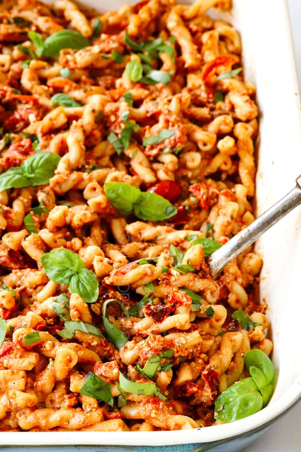 TikTok Feta Pasta in a dish with tomatoes, olive oil, garlic and basil