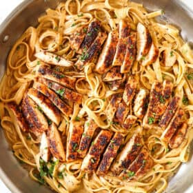 top view of Blackened Chicken Alfredo in a stainless steel skillet