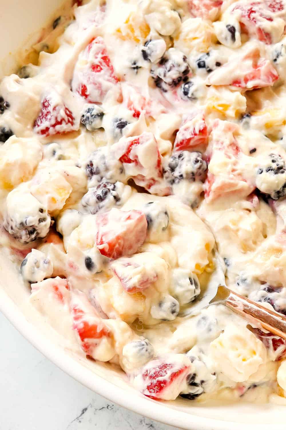up close of serving cheesecake salad by scooping it with a spoon